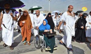 Hajj pilgrims going to Jamarat for performing Hajj ritual to throw pebbles at three pillars that represent Satan