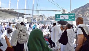 Hajj pilgrims going to Jamarat for performing Hajj ritual to throw pebbles at three pillars that represent Satan