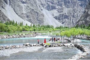 A person catching fishs at the Uper Kachura Xhoq lake in the mountain area of north Pakistan.