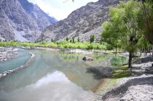 A person catching fishs at the Uper Kachura Xhoq lake in the mountain area of north Pakistan.