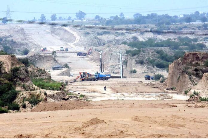 Heavy machinery being used during construction work of Rawalpindi Ring Road project, Rawalpindi Ring Road is 38.3 kilometer between the cities of Rawalpindi and Islamabad. Ring Road starts from Channi Alam Sher Bridge near Rawat and end near Thalian Interchange close to the Lahore-Islamabad Motorway