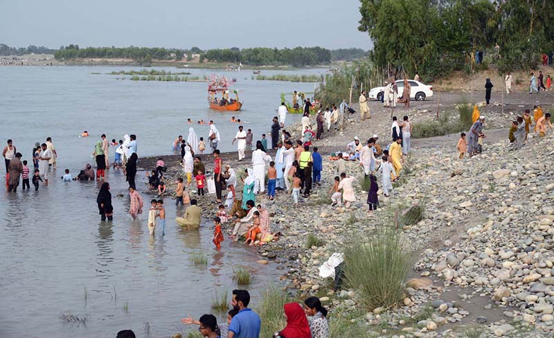 Visitors are enjoying the swing at Picnic Point near the Attock River ...