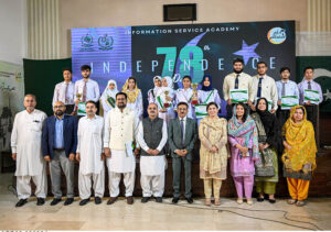 Executive Director General of Information Service Academy (ISA) Muhammad Arshad Munir poses for a group photo during an event organized to mark the 78th Independence Day celebrations