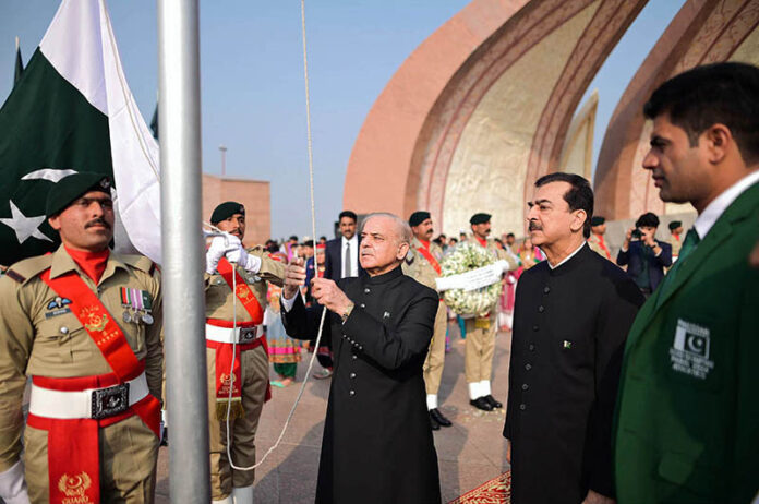 Prime Minister Muhammad Shehbaz Sharif hoists the national flag at the Pakistan Monument on the 78th Independence Day