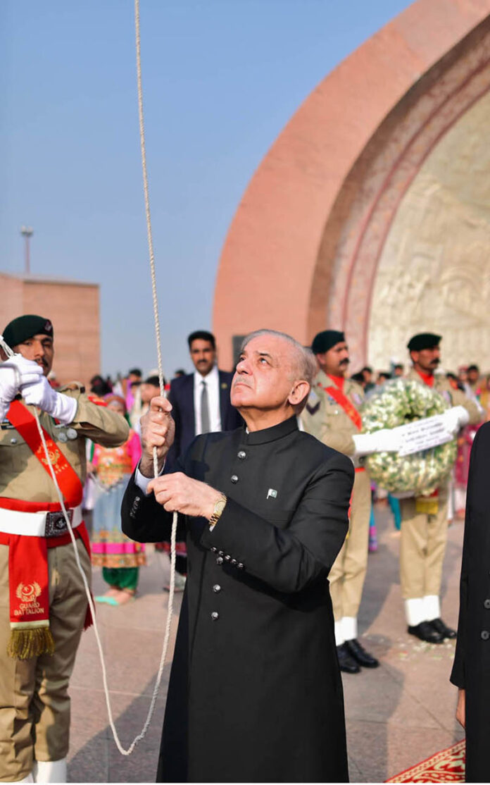 Prime Minister Muhammad Shehbaz Sharif hoists the national flag at the Pakistan Monument on the 78th Independence Day