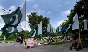 A vendor selling flags and children clothes to mark the 78th Independence Day celebrations