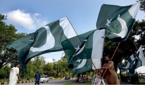 A vendor selling flags and children clothes to mark the 78th Independence Day celebrations