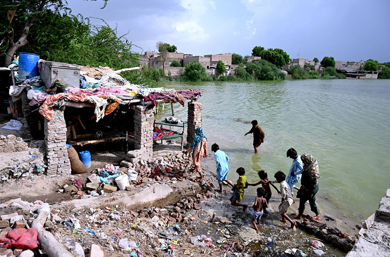 Slum area submerged in river water near River Indus.