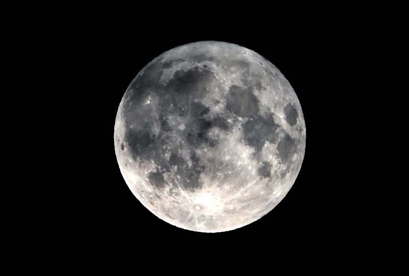 A view of the first super blue moon of 2024 over the skies of the