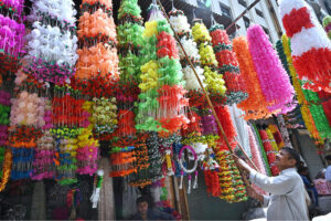 A vendor displays decorative items in preparation of Eid Milad-ul-Nabi (SAW) celebrations at Gumpat Road