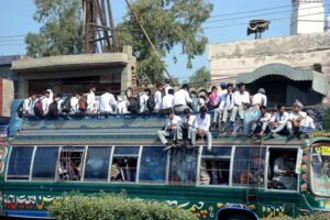 A large number of students traveling in a dangerous way on rooftop of passenger bus may cause any mishap and needs the attention of concerned authorities