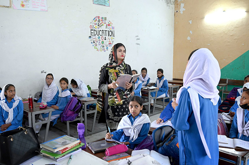 A teacher performing her duty at a local school as world celebrates the ...