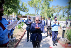 Prime Minister Muhammad Shehbaz Sharif offers Dua after laying a floral wreath at Yadgar-e-Shuhada in the Police Lines Headquarters.