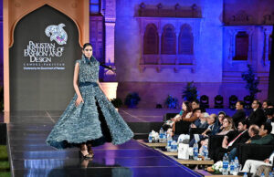 Model walks the ramp during the fashion presentation at the inauguration of the Pakistan Institute of Fashion and Design (PIFD) at Mohatta Palace, Museum Karach.