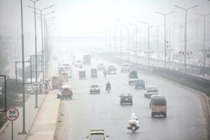 Vehicles on the way during fog that engulfs the whole city during morning time at Chamkani GT road.