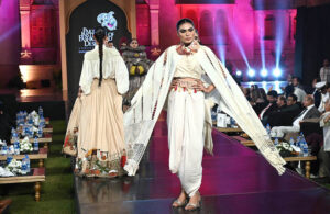 Model walks the ramp during the fashion presentation at the inauguration of the Pakistan Institute of Fashion and Design (PIFD) at Mohatta Palace, Museum Karach.