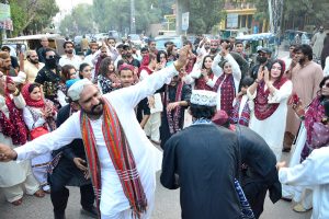 Women participate in a rally in connection with upcoming Sindhi Culture Day outside Press Club