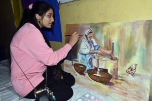 An art student participate to show her creativity in an arts and painting competition organized by the Knowledge of Art Academy at Ravi Road