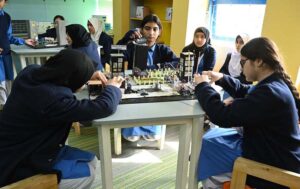 Students engage in a thoughtful interesting chess match, developing their strategic and cognitive skills through play in ICG, F-6/2 ,federal capital.