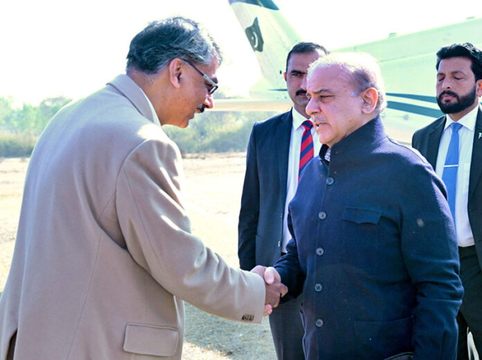 Prime Minister Muhammad Shehbaz Sharif is being received by Prime Minister of Azad Jammu and Kashmir Chaudhry Anwaar-ul-Haq at Bhimber Helipad