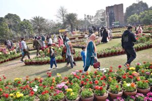 Families are viewing a flower Exhibition at Jillani Park.