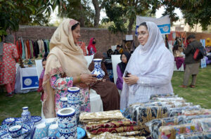 Woman visiting stalls during the 3rd edition of "Hamari Dastan" organized by the Women Chamber of Commerce and Industries at the Ladies Club.