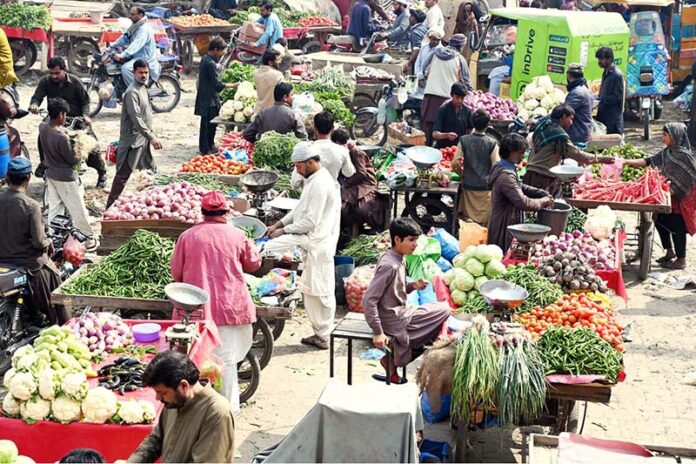 A large number of vendors selling fresh vegetables at Jelas Market Chowk