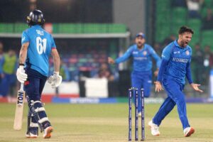 Afghanistan bowler Azmatullah celebrates the wicket of “Phil Salt” during the ICC Champions Trophy one-day international (ODI) cricket match between Afghanistan and England at the Gaddafi Stadium.