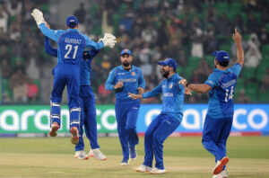 Afghanistan bowler Azmatullah celebrates the wicket of “Phil Salt” during the ICC Champions Trophy one-day international (ODI) cricket match between Afghanistan and England at the Gaddafi Stadium.