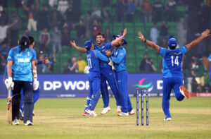 Afghanistan players celebrate after winning the crucial ICC Champions Trophy one-day international (ODI) cricket match against England at the Gaddafi Stadium.