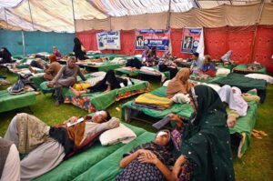 A doctor examining a patient during free eye camp organized by host lions club at Police ground.