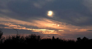 A breathtaking view of the sunset with scattered clouds painting the sky in the Federal Capital.