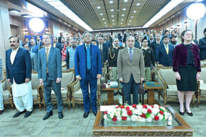 Prime Minister Muhammad Shehbaz Sharif stands in honor of the National Anthem at the launching ceremony of Case Assignment and Management System.