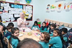 The First Lady of Turkiye, Mrs. Emine Erdogan, interacted with students in a classroom during her visit to the Maarif School in Sector H-8