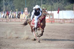 Horse riders showcase their skills in a tent-pegging competition held as part of the 10th Lyallpur Arts & Literature Festival at the University of Agriculture Faisalabad (UAF).