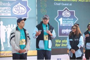 Federal Minister for Finance and Revenue, Senator Muhammad Aurangzeb, addresses the audience at the 1st Faysal Bank SOP Unified Marathon Lahore, 2025, highlighting the importance of inclusivity and support for athletes with special needs.