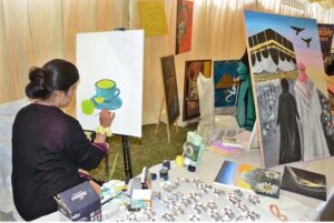 Student is giving final touches to her painting during All Pakistan Business Startup Expo of 10th Lyallpur Arts & Literature Festival at University of Agriculture Faisalabad (UAF).