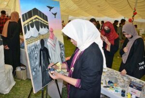 Student is giving final touches to her painting during All Pakistan Business Startup Expo of 10th Lyallpur Arts & Literature Festival at University of Agriculture Faisalabad (UAF).