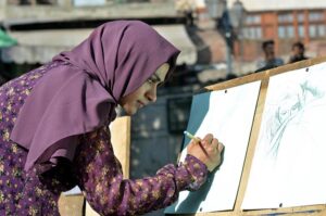 Student making sketch during Painting and Calligraphy Exhibition organized in collaboration with Walled City at Masjid Wazir khan Square inside the Knowledge of Art Academy at Delhi Gate