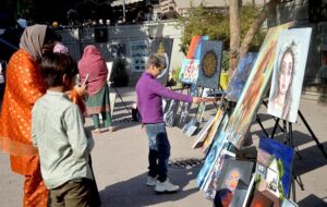 Student making sketch during Painting and Calligraphy Exhibition organized in collaboration with Walled City at Masjid Wazir khan Square inside the Knowledge of Art Academy at Delhi Gate