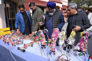 Women displaying Punjabi cultural itmes On International Mother Language Day, at Shimla Hill Chowk.