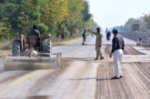 Laborers are busy repairing the Hyderabad to Mirpur Khas road.