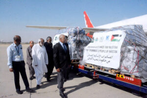 Vice President Al Khidmat Foundation Air Vice Marshall (Retd) Arshad Malik inspecting relief goods for Palestinians at old terminal of Karachi Airport