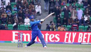 Afghanistan batter Azmat Ullah plays a shot during the ICC Champions Trophy (ODI) cricket match between Afghanistan and Australia at the Gaddafi Stadium.