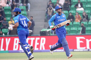 Afghanistan batter Azmat Ullah plays a shot during the ICC Champions Trophy (ODI) cricket match between Afghanistan and Australia at the Gaddafi Stadium.