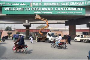 CBP workers busy in maintenance Peshawar welcome board lights in front of Qilla Balasar.