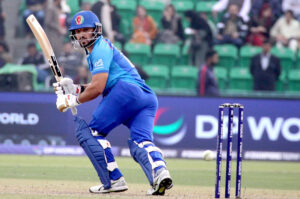 Afghanistan batter Azmat Ullah plays a shot during the ICC Champions Trophy (ODI) cricket match between Afghanistan and Australia at the Gaddafi Stadium.