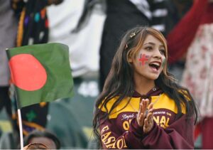 Enthusiastic female cricket fans cheer and waving their hands in excitement during the ICC Champions Trophy match between Bangladesh and New Zealand at Rawalpindi Cricket Stadium