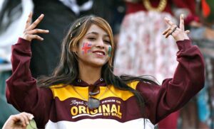 Enthusiastic female cricket fans cheer and waving their hands in excitement during the ICC Champions Trophy match between Bangladesh and New Zealand at Rawalpindi Cricket Stadium