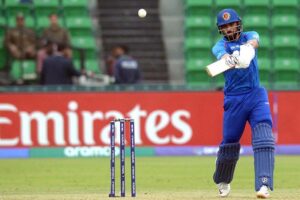 Afghanistan player Ibrahim Zadran plays a shot during the ICC Champions Trophy one-day international (ODI) cricket match between Afghanistan and England at the Gaddafi Stadium.